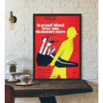 displays the tall blond with a black shoe