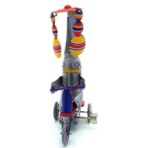 vintage toy elephant on tricycle